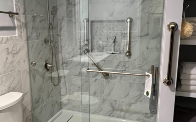 What Are the Differences Between Grab Bars and Towel Bars on Glass Shower Doors?